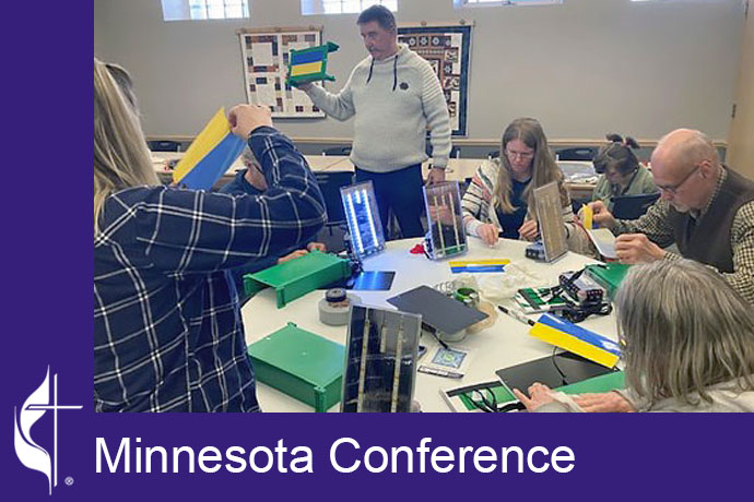 Members of United Church of Two Harbors assemble Ray of Life solar units for the people of Ukraine. Photo courtesy of the Minnesota Conference.