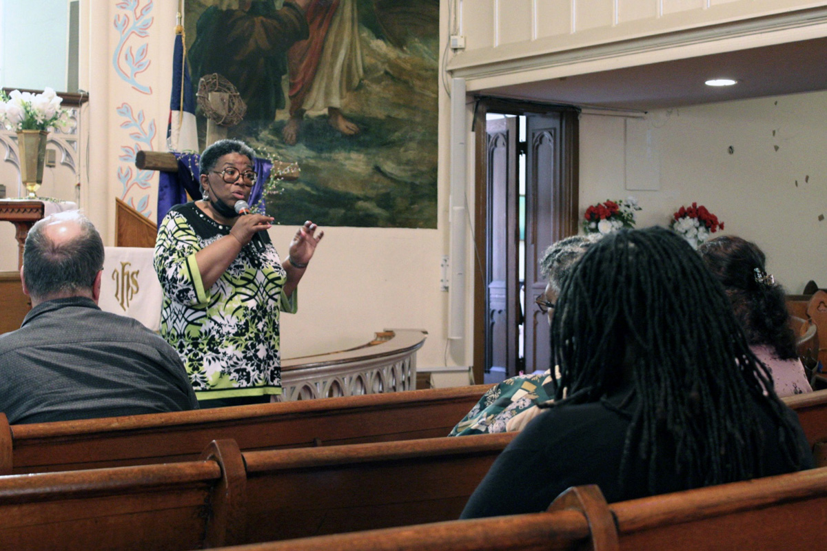 Pamela Coleman, chair of the history committee at Sharp Street Memorial United Methodist Church, speaks to visitors from the Social Justice Pilgrimage about the joys and struggles of the historic church in west Baltimore. The once bustling “Mother Church of African American Methodism” now hosts about 20 worshippers on Sundays. Photo by Vernon Jordan, UM News.