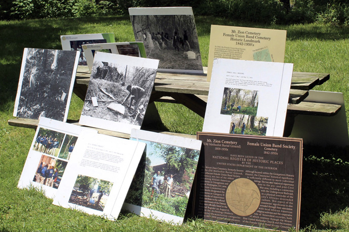 Near the entrance of Mt. Zion Cemetery in Washington, a historical marker is accompanied by a collage of photos displaying the history of the cemetery dating back to 1809. Photo by Vernon Jordan, UM News. To enlarge this image, click here.
