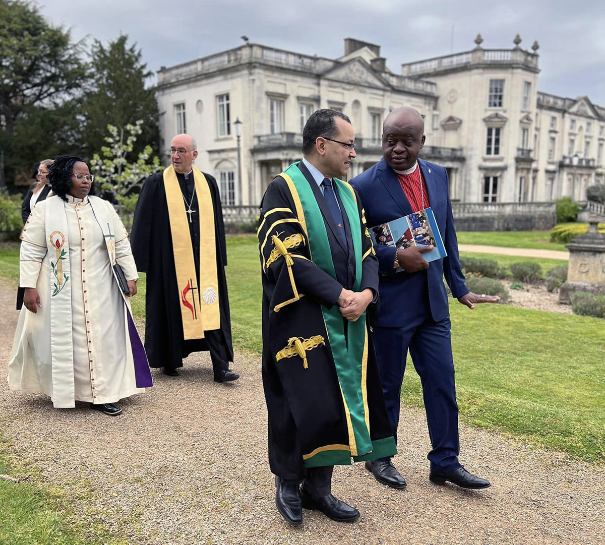 (From left) Bishop Pumla Nzimande, the Methodist Church of Southern Africa; the Rev. Graham Thompson, president of the Methodist Conference 2022/2023 in Britain; Amos Nascimento, United Methodist General Board of Higher Education and Ministry; and United Methodist Bishop Mande Muyombo, resident bishop of the North Katanga Area, join in a procession at the University of Roehampton, London, England, during the 10th joint international conference of the International Association of Methodist Schools, Colleges and Universities in Great Britain, April 25-May 1. Photo by Kimberly Lord, the United Methodist Board of Higher Education and Ministry.