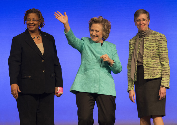 Harriett Jane Olson (right) and Yvette Richards (left) of United Methodist Women stand with Hillary Rodham Clinton after Clinton addressed the Women's Assembly in 2014 in Louisville, Ky. Olson retired in May after 15 years as top executive of the agency, which is now called United Women in Faith. File photo by Mike DuBose, UM News.