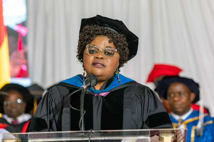 Guest of honor and keynote speaker Professor Theresa Nkuo-Akenji speaks during the  graduation ceremony June 10 at Africa University in Mutare, Zimbabwe. Akenji encouraged the graduating class to seed their talents and skills within their communities. Photo by Arty Events for Africa University.