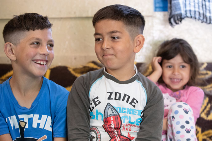 Manuel, Moses and Renatta stay with the rest of their family at the United Methodist Dorcas church camp in Debrecen, Hungary, after fleeing the war in Ukraine. 2022 file photo by Mike DuBose, UM News.