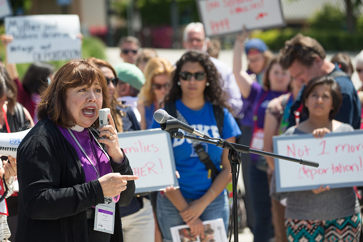 Bishop Minerva Carcaño addresses a rally of United Methodists in support of immigration reform at the Convention Center Plaza outside the 2016 General Conference in Portland, Ore. Carcaño, who is facing a church trial on undisclosed charges, talked to United Methodist News about her 47 years of ministry and what The United Methodist Church means to her. File photo by Mike DuBose, UM News.