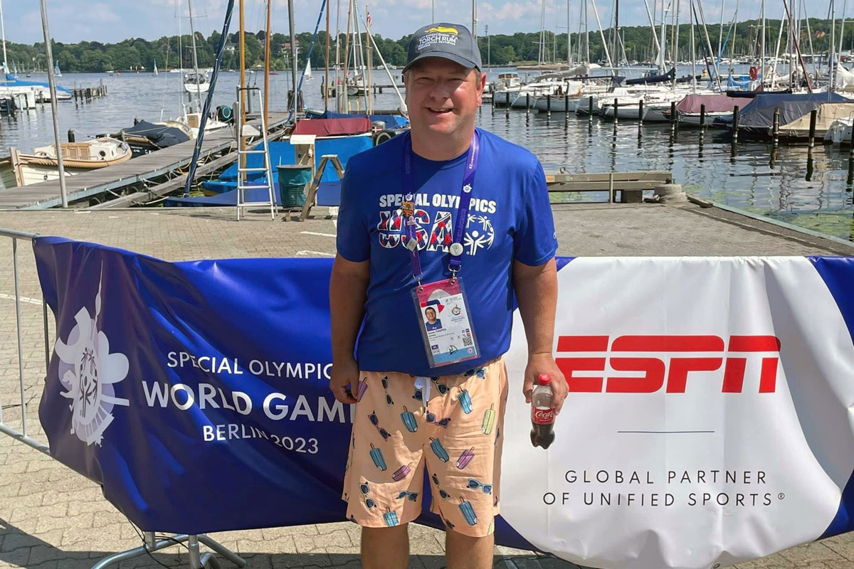 James Thigpen won a bronze medal in sailing during the 2023 Special Olympics World Games in Berlin. He is standing on the dock of the club Seglerhaus am Wannsee, the second-oldest sailing club in Germany, where the sailing competition was held June 17-25. Photo courtesy of Wesley Glen Ministries.