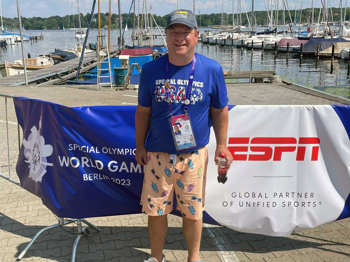 James Thigpen won a bronze medal in sailing during the 2023 Special Olympics World Games in Berlin. He is standing on the dock of the club Seglerhaus am Wannsee, the second-oldest sailing club in Germany, where the sailing competition was held June 17-25. Photo courtesy of Wesley Glen Ministries.  