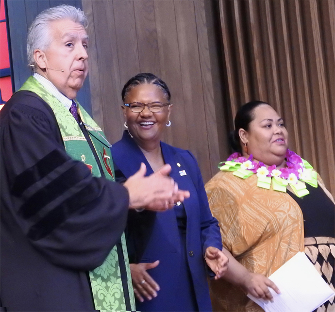 Bishop Ruben Saenz Jr., Sally Vonner (center) and ‘Ainise ‘Isama’u take the stage during Vonner’s July 29 installation service as top executive of United Methodist Women in Faith. The service was at Dallas’ Lovers Lane United Church. Photo by Sam Hodges, UM News.