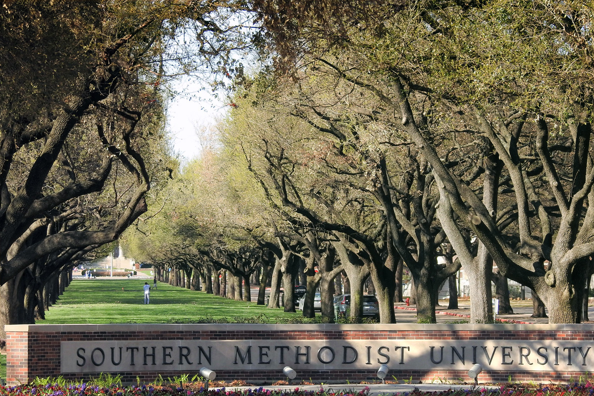 The live oak-lined entrance to Southern Methodist University in Dallas. A lawsuit continues between SMU and the South Central Jurisdictional Conference of The United Methodist Church. A recent Texas appeals court ruling largely favors the conference in its bid to retain some governance over the Dallas school. File photo by Sam Hodges, UM News.