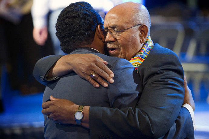 United Methodist Bishop Melvin G. Talbert (right) prays with a delegate during evening worship at the 2012 United Methodist General Conference in Tampa, Fla. Bishop Talbert, an ardent advocate for human rights, died Aug. 3. File photo by Mike DuBose, UM News.