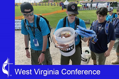 At their 2023 Jamboree in West Virginia, Boy Scouts put together 5-gallon flood buckets, also known as UMCOR Cleaning Kits, equipped with laundry detergent, household cleaner, insect repellent, other cleaning supplies, N95 masks, and more. Photo courtesy of the West Virginia Conference.