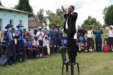 Elijah Chakwizira of Student Connect Trust conducts an ice-breaking exercise with students from Murape and Seke Materera secondary schools in Seke, Zimbabwe. The organization conducts leadership and life-skills training, career development and team building. Photo by Eveline Chikwanah, UM News.  Elijah Chakwizira of Student Connect Trust conducts an ice-breaking exercise with students from Murape and Seke Materera secondary schools in Seke, Zimbabwe. The organization conducts leadership and life-skills training, career development and team building. Photo by Eveline Chikwanah, UM News.