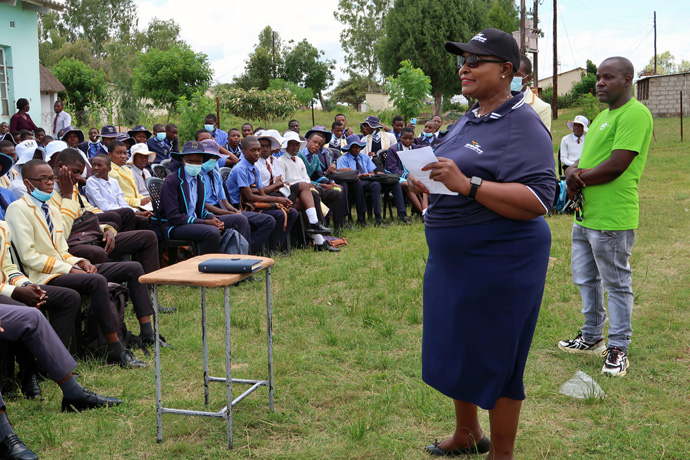 Matilda Simboti of Air Zimbabwe gives students a brief overview of the operations of the national airline during a church-sponsored career expo at Murape and Seke Materera secondary schools in Seke, Zimbabwe. The rare sight of the Air Zimbabwe bus at the school attracted students and members of the neighboring community. Photo by Eveline Chikwanah, UM News. 
