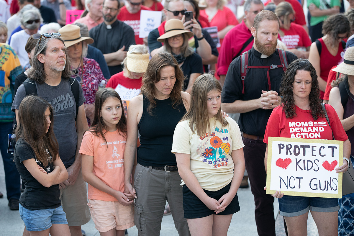 Supporters of gun reform join in prayer outside the Tennessee State Capitol in Nashville on Aug. 21 as lawmakers begin a special legislative session focused on public safety following a mass shooting at the Covenant School here in March. Joining the prayer is the Rev. Eric Mayle (second from right) of Calvary United Methodist Church in Nashville. Photo by Mike DuBose, UM News.