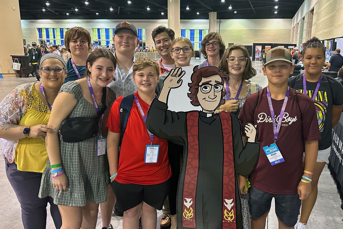 Eighth-grader Ainsley M. (fifth from right) poses with John Wesley and members of  Wildwood United Methodist Church in the Texas Conference at Discipleship Ministries’ Youth 2023 event in Daytona Beach, Fla. in July. Young people from around the United Methodist connection shared their experiences from the gathering with UM News. Photo courtesy of Jessica McMullen, Minister of Families and Communications for Wildwood United Methodist Church.