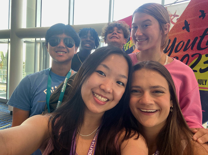 Emma Yeon (left), a high school junior from the Great Plains Conference, takes a selfie with friends during the Youth 2023 event in Daytona Beach, Fla., in July. Yeon came away with the understanding that individuals can “worship and feel God’s presence by just being ourselves.” Photo courtesy of Emma Yeon.