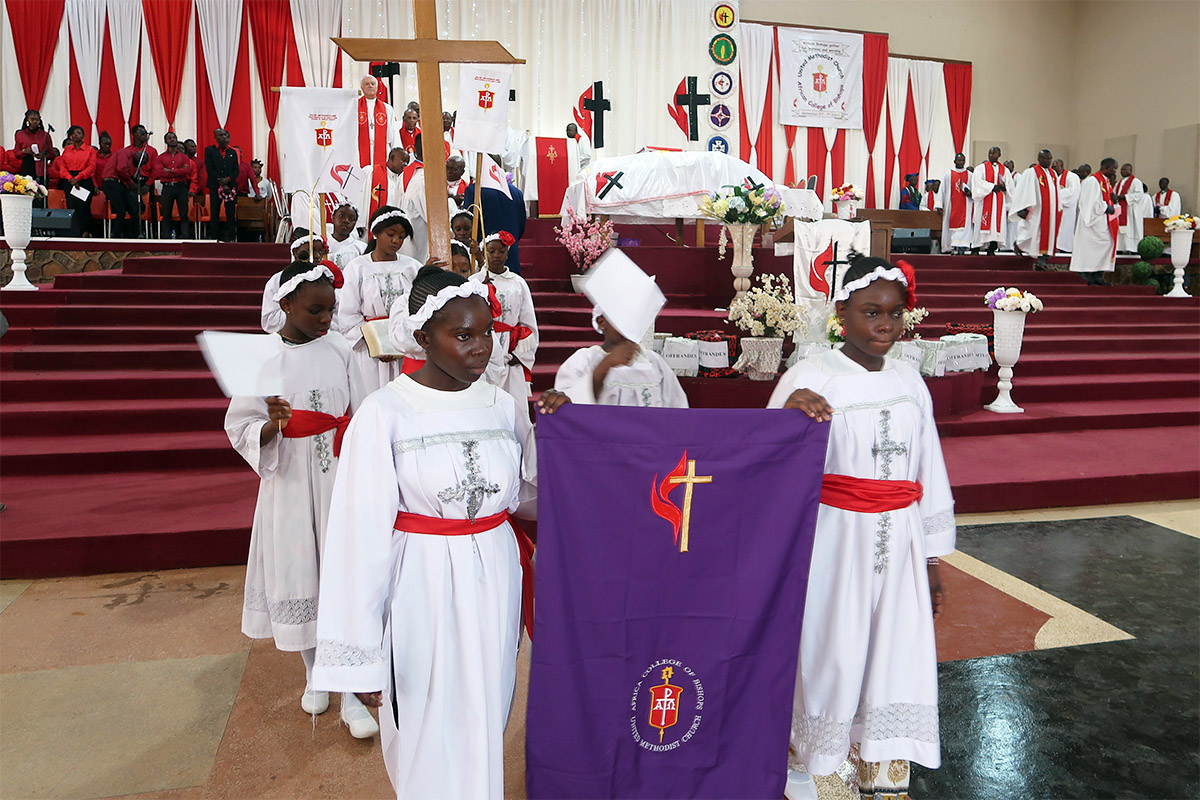 Children from the Congo lead the recession of bishops from the Memorial du Centenaire Cathedral in Lubumbashi, Congo, following the opening worship service for the Africa Colleges of Bishops retreat that took place Sept. 2-7. Over 3,000 people attended the service where Council of Bishops president Thomas J Bickerton preached about the power of love in troubling times. Photo by Eveline Chikwanah, UM News.