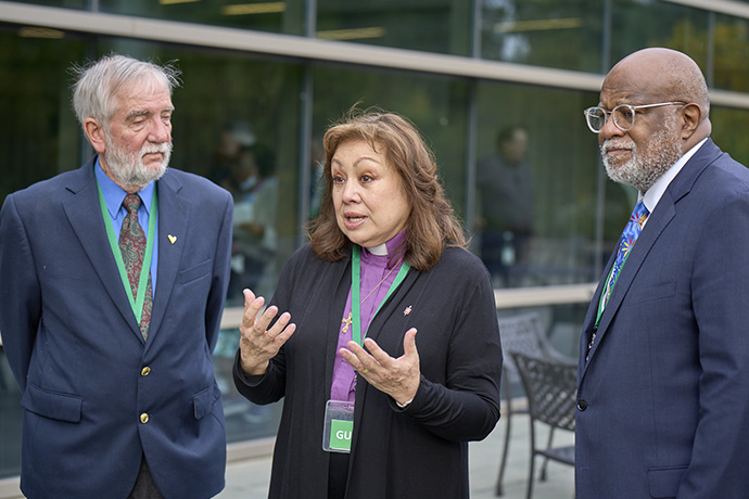 United Methodist Bishop Minerva G. Carcaño speaks to the press in Glenview, Ill., on Sept. 22, following a unanimous not guilty verdict rendered by the jury in her church trial. She faced four charges of violating church law, stemming from three complaints. Carcaño is accompanied by her counsel in the trial: the Rev. Scott Campbell (left) and Judge Jon Gray. Photo by Paul Jeffrey, UM News.