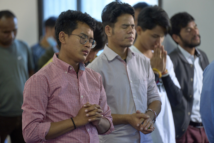 Men pray during worship at Hebron United Methodist Church on May 20 in Lalitpur, Nepal. Photo by Paul Jeffrey, UM News.