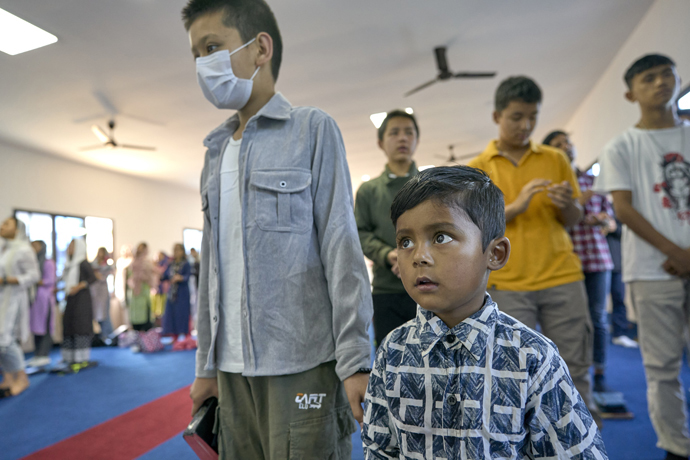 A boy participates in worship at Hebron United Methodist Church in Lalitpur, Nepal, on May 20. Photo by Paul Jeffrey, UM News.