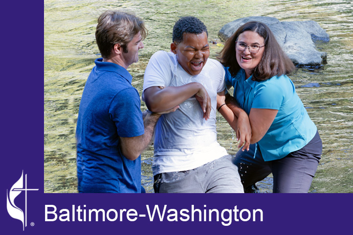 The Rev. Jenny Smith (right) and Director of Youth Ministries, Tim McKenzie (left) baptize a young person at Patapsco River in Eldersburg, Md., on Oct. 1. Photo by Brenda Bowman, Wesley Freedom United Methodist Church.    