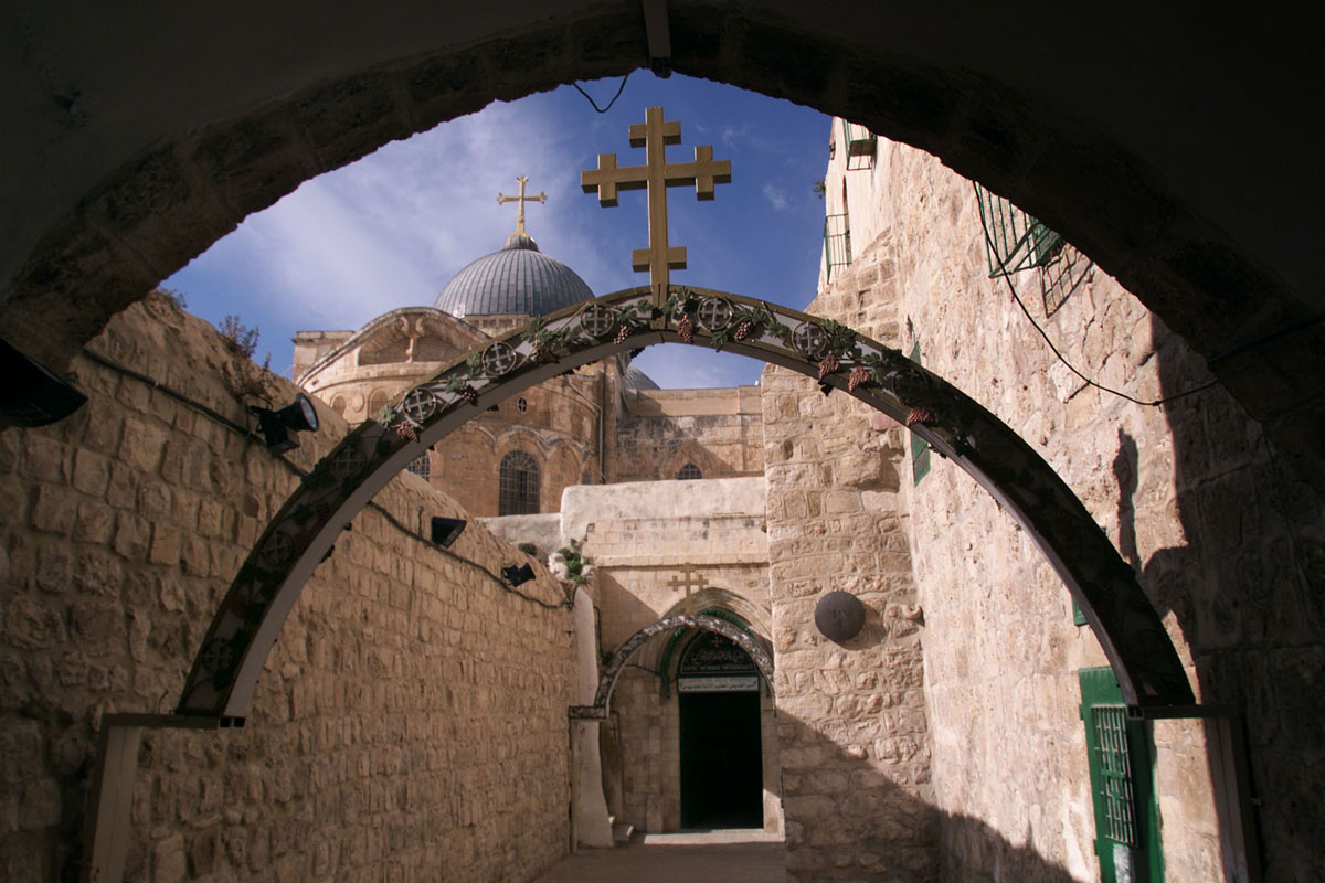The dome atop the Church of the Holy Sepulchre is framed by archways inside Jerusalem's ancient walled city. The church is considered to contain the sites of Christ's crucifixion, entombment and resurrection. Holy Land pilgrims from the U.S. had to change their plans because of the Hamas terrorist attack on Israel. 2000 file photo by Mike DuBose, UM News. 