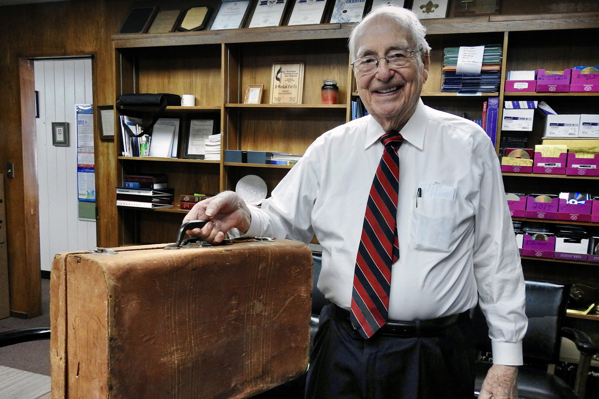 The Rev. Roberto Escamilla shows the suitcase he carried when traveling from Mexico to Iowa at age 17, to attend Parsons College. Escamilla would go on to a long, distinguished career in United Methodist ministry, and became an interpreter and traveling companion for famed Methodist missionary evangelist E. Stanley Jones. Photo by Sam Hodges, UM News.