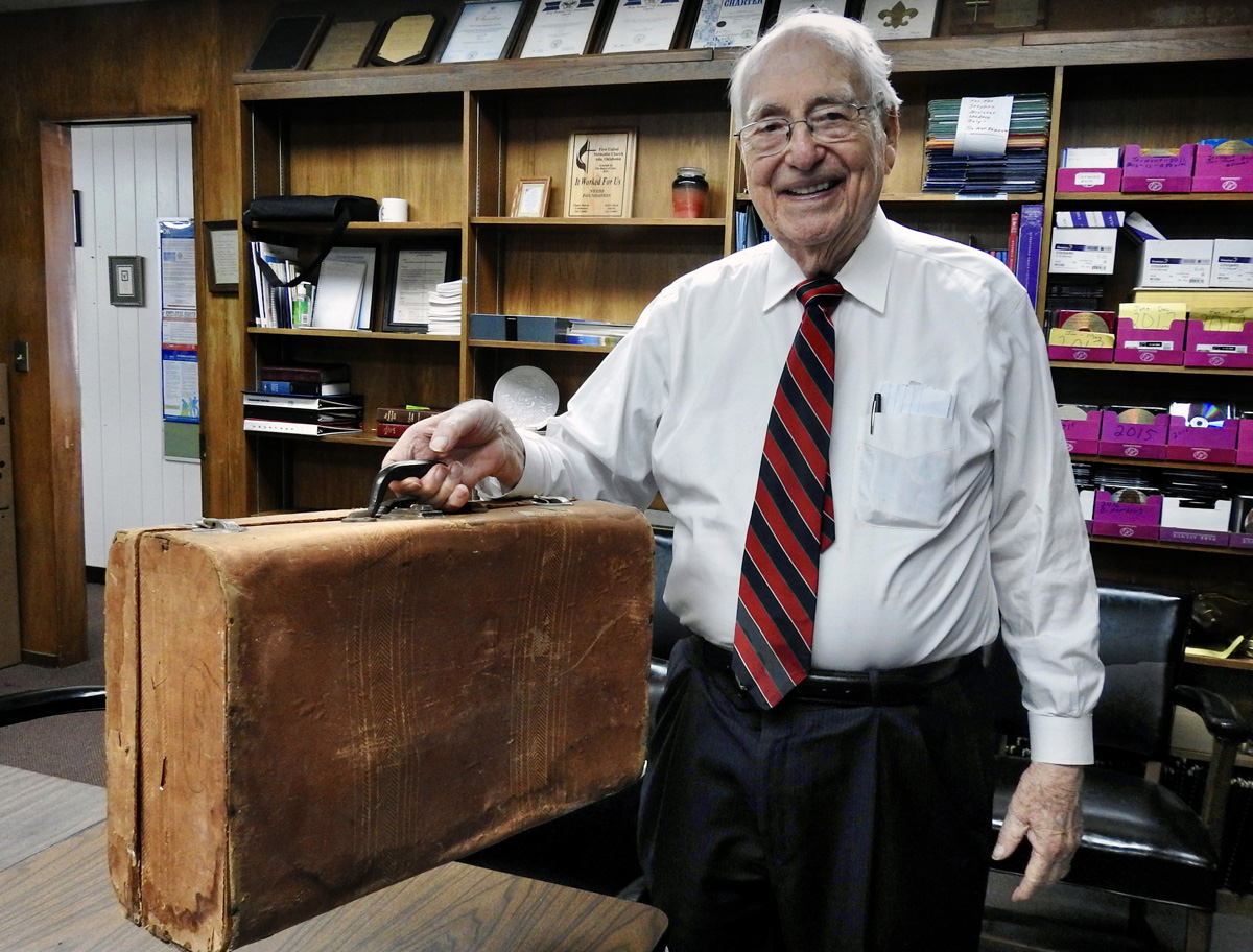 The Rev. Roberto Escamilla shows the suitcase he carried when traveling from Mexico to Iowa at age 17, to attend Parsons College. Escamilla would go on to a long, distinguished career in United Methodist ministry, and became an interpreter and traveling companion for famed Methodist missionary evangelist E. Stanley Jones. Photo by Sam Hodges, UM News.