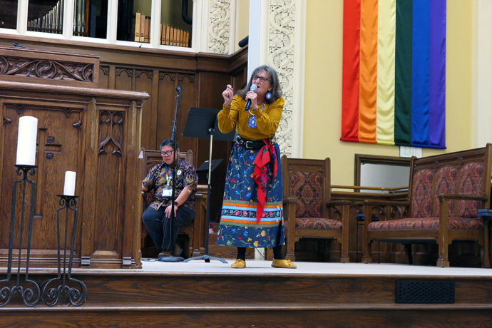 Ragghi Rain Calentine, an Eastern Cherokee and chair of The United Methodist Church’s Native American International Conference, tells a story to explain the trauma resulting from Indigenous boarding schools. She and other representatives from the denomination’s ethnic caucuses and national plans for ethnic ministries spoke Oct. 13 at the Reconciling Ministries Network Convocation at First United Methodist Church in Charlotte, N.C. Photo by Heather Hahn, UM News.