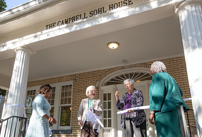 Barbara Campbell (center, left) and Joyce Sohl (center, right) cut the ribbon during the dedication service for the Campbell Sohl House at Scarritt Bennett Center in Nashville, Tenn. Standing with them are Sondrea Tolbert (left), the center’s executive director, and board chair Andréa Hatcher. Photo by Mike DuBose, UM News.