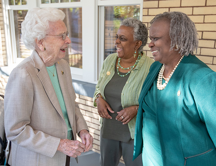 Barbara Campbell (left) visits with Valerie Ann Johnson (center) and Andréa Hatcher during the dedication service for the Campbell Sohl House at Scarritt Bennett Center in Nashville, Tenn. Campbell is a former president of the center and Johnson and Hatcher serve on its board of directors. Photo by Mike DuBose, UM News.