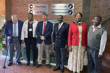 From left, Warren Plowden, Africa University acting dean Linet Sithole, Kent Fulton, N. Oswald Tweh, Lidia Gulele and Africa University Professor Christopher Munguma take a group photo after Judicial Council members Plowden, Fulton, Tweh and Gulele visited a class at the university’s law school in Mutare, Zimbabwe. Five other members of the Judicial Council, all United Methodist clergy, visited the university’s theology school. Photo courtesy of Africa University.