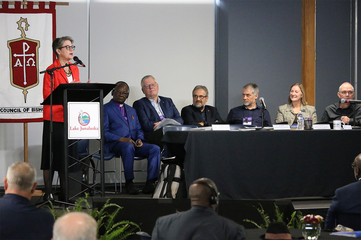 Bishop Sally Dyck, ecumenical officer for the Council of Bishops, speaks about the importance of The United Methodist Church’s relationships with other Christian bodies and the challenges those relations face. Sitting to her right are East Congo Area Bishop Gabriel Yemba Unda, Nordic-Baltic Area Bishop Christian Alsted, Germany Area Bishop Harald  Rückert, Central and Southern Europe Area Bishop Stefan Zürcher and ecumenical staff officers the Rev. Jean Hawxhurst and David N. Field. Photo by Rick Wolcott, courtesy of the Council of Bishops. 