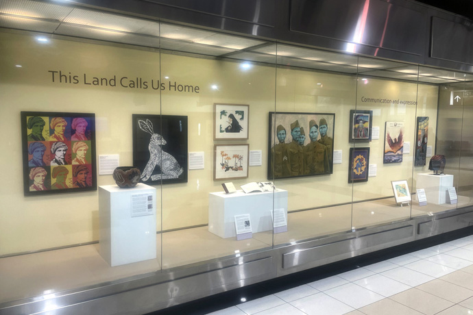 An exhibit at Hartsfield-Jackson Atlanta International Airport in Atlanta, “This Land Calls Us Home: Indigenous Relationships with Southeastern Homelands,” showcases 60 works of art by 26 Native American artists. It will be on display in the T North Concourse until November 2024. Photo by Jim Patterson, UM News.