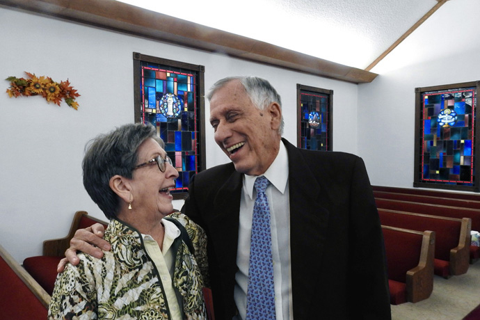 Nancy Virden and the Rev. Ron Welborn share a laugh after worship at La Trinidad United Methodist Church on Nov. 19. Virden and Welborn are part of Walnut Springs United Methodist, a Seguin group that formed earlier this year after First United Methodist Church of Seguin voted to disaffiliate. La Trinidad has provided worship space for Walnut Springs, and the two congregations occasionally worship together, as they did on Nov. 19. Photo by Sam Hodges, UM News.