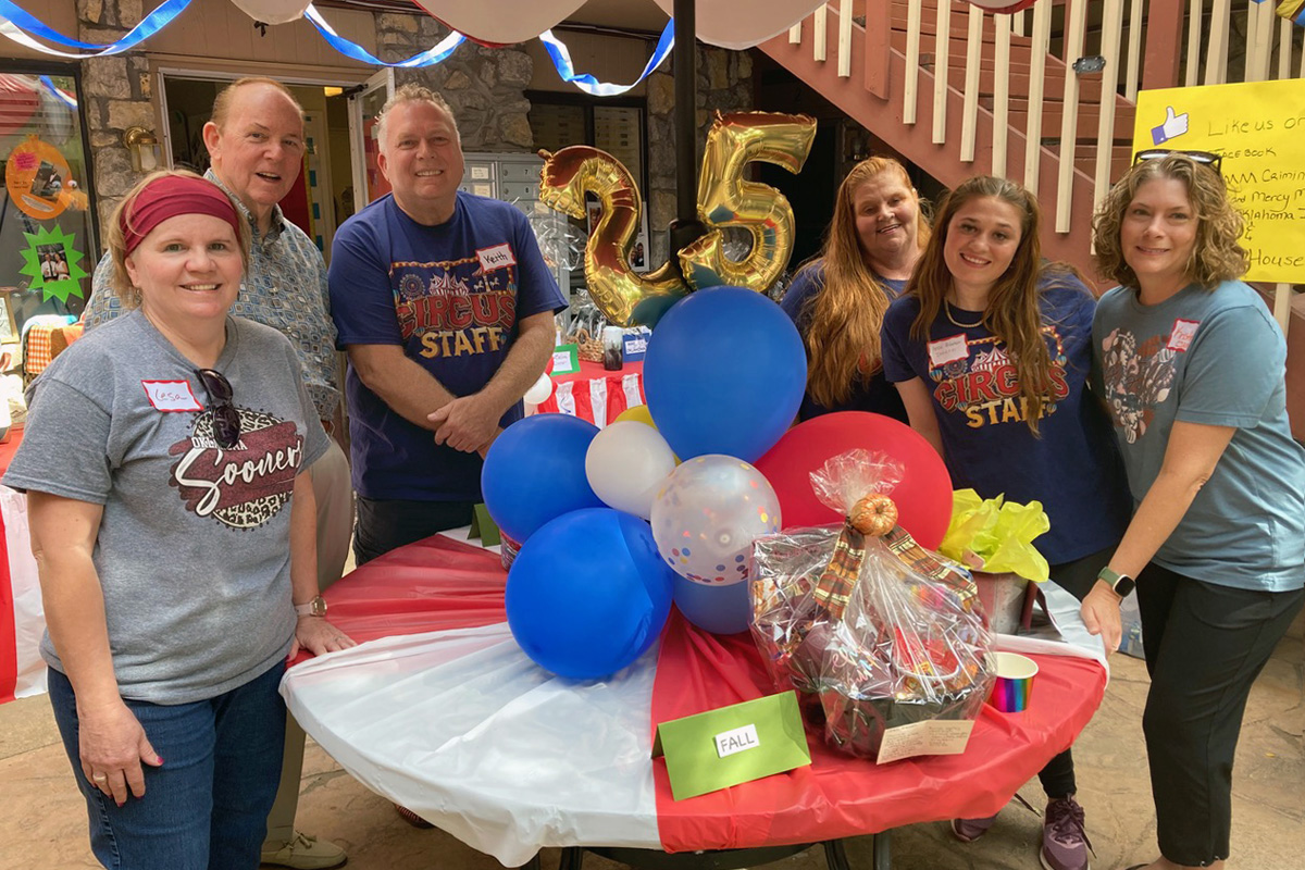 About 85 people gathered to celebrate the 25th anniversary of Exodus House, a ministry of the Oklahoma Conference of The United Methodist Church, on Oct. 21 in Oklahoma City. From left are Lesa Rhoads, Exodus House assistant director; Lew McGinnis, a member of the Exodus House board; Keith Dobbs, executive director of Criminal Justice and Mercy Ministries; Robin Wertz, resident director of Exodus House; Anne Robertson, intern for CJAMM; and Kristin Ferrell-Wilkes, New Day Camp office assistant. Photo by Boyce Bowdon, UM News.