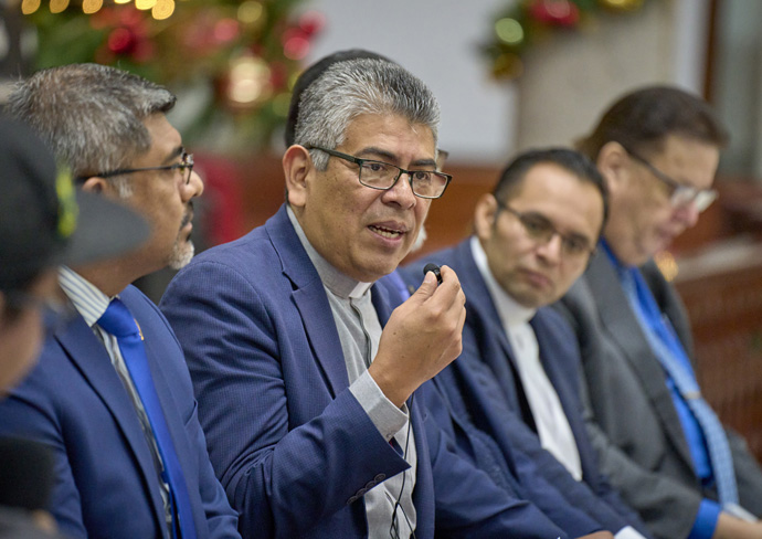 Bishop Agustín Altamirano Ramos (center) speaks during a Dec. 2, 2023, session of a conference observing the 150th anniversary of the founding of the Methodist Church of Mexico. The bishop, who heads the Mexico City-based Mexico Annual Conference, is surrounded by the country's other five Methodist bishops who responded to a series of questions asked by youth in the church. Photo by Paul Jeffrey, UM News.