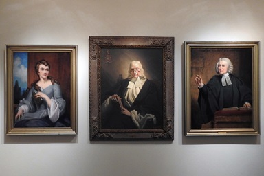 Portraits of Susanna Wesley, John Wesley and Charles Wesley, done by Frank O. Salisbury, are prominently displayed in the World Methodist Museum Collections exhibit. The recently opened exhibit is at Bridwell Library, on the campus of Southern Methodist University’s Perkins School of Theology, in Dallas. Photo by Sam Hodges, UM News.
