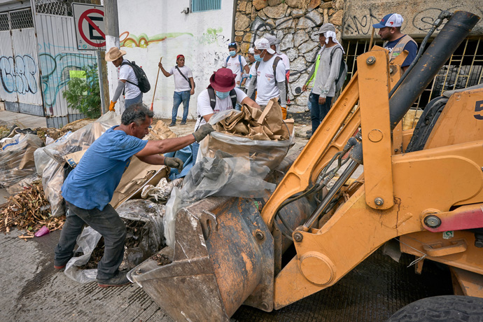 Residents of Acapulco, Mexico, work together cleaning their streets weeks after the devastating passage of Hurricane Otis, which struck the seaside city Oct. 25. At least 52 people were killed in Mexico, according to official reports. Photo by the Rev. Paul Jeffrey, UM News.