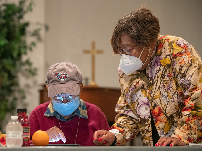 Angella P. Current-Felder (right) helps Ethel Battle learn how to use her new tablet computer during a training session for “Project Connect” at Gordon Memorial United Methodist Church in Nashville, Tenn., in 2021. The church received a $7,000 grant from Discipleship Ministries to help seniors remain connected to church and community services, many of which moved online during the COVID-19 pandemic. File photo by Mike DuBose, UM News.
