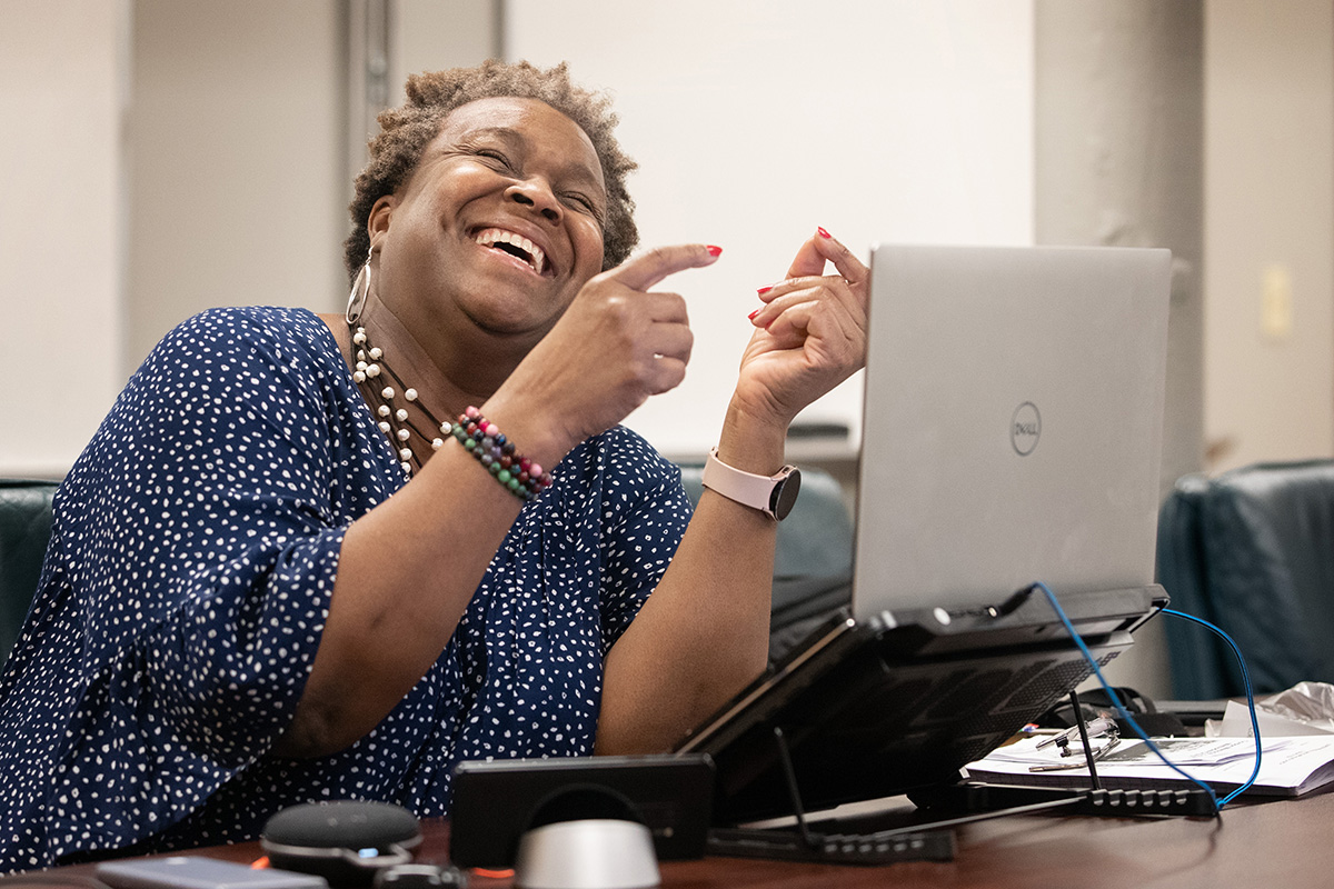 Tina Boone shares the joy of Sunday worship with homebound and distant participants through the conference phone at Gordon Memorial United Methodist Church in Nashville, Tenn. The program, started during the COVID-19 pandemic, allows people who don’t have a computer or internet access to dial in and hear the entire service through their telephone. Photo by Mike DuBose, UM News.