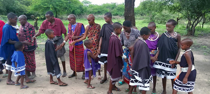 Faithful Masai United Methodists gather after a service at a local United Methodist church in Kambala, Tanzania. Recent flooding in the region left many church members homeless. The United Methodist Church has been involved in evangelism efforts with the Masai people —seminomadic herders and warriors from East Africa — since 2004. Photo by Samsoni Kinoka, Masai District.