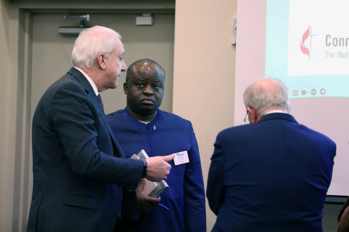 Three bishops talk during the joint General Council on Finance and Administration board and Connectional Table meeting on Feb. 19-20 in Franklin, Tennessee. From left, are New York Conference Bishop Thomas J. Bickerton, Council of Bishops president; North Katanga Area Bishop Mande Muyombo, Connectional Table chair; and retired Bishop Michael McKee, GCFA board president. Photo by Melissa Jackson, General Council on Finance and Administration.