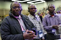 Vagris Umba (from left), Bertin Kyungu and Adolphe Kitenge, delegates from the North Katanga Conference in Congo, listen to the morning worship at the 2016 United Methodist General Conference at the Portland Convention Center in Portland, Ore. The proposed regionalization legislation coming to General Conference on April 23-May 3 is generating a lot of discussion among African United Methodists. Their votes could be key to whether regionalization can pass. File photo by Kathleen Barry, UM News.