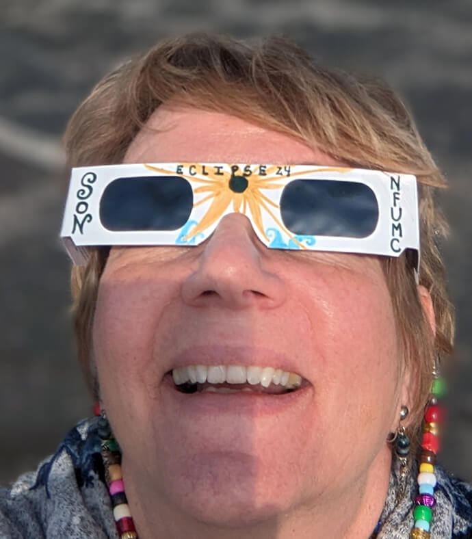 Dawn Freeman models eclipse-viewing glasses. Freeman, an art therapist, will be supervising on March 21st at Norwalk First United Methodist Church, in Norwalk, Ohio, as people purchase and personalize glasses for the April 8 total solar eclipse. Photo courtesy Dawn Freeman. 