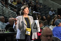 Barbara Boigegrain answers questions during a 2016 General Conference debate about divestment of fossil fuel company stocks. Boigegrain was top executive of Wespath, the denomination’s pension and benefits agency. She has since retired. Wespath continues to oppose efforts to require United Methodist institutions to divest from fossil fuel stocks, saying engagement with such companies is a more effective strategy for combating climate change. File photo by Maile Bradfield, UM News.