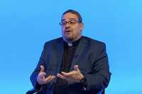 The top executive of the Commission on Religion and Race, the Rev. Giovanni Arroyo, talks about several pieces of legislation dealing with racial inclusion during the Feb. 29–March 1 orientation for delegates hosted by United Methodist Communications and the Secretary of the General Conference. Screengrab courtesy of United Methodist Communications via Zoom by UM News.