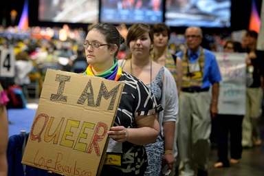 Demonstrators at the May 1 session of the 2012 United Methodist General Conference in Tampa, Fla., call on delegates to defeat or remove legislation that discriminates against people based on their sexual orientation. File photo by Paul Jeffrey, UM News.