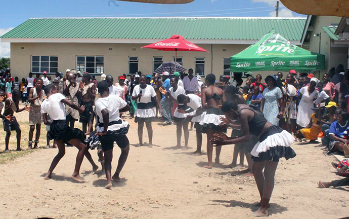 Students from Chinyamuhwera High School perform a traditional dance during the dedication ceremony for the new Munyarari Mission Clinic in Munyarari, Zimbabwe. The clinic boasts three patient wings, a spacious waiting area and a fenced and gated campus. Photo by Kudzai Chingwe, UM News.