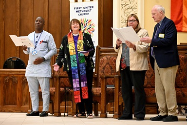 The United Methodist Global AIDS Committee hosted the Breaking Barriers AIDS Conference at First United Methodist Church in Charlotte, N.C., on April 22, ahead of The United Methodist Church’s General Conference. Participating in the closing service are (from left) Missionary Patrick Abro, Health Operation Manager of the Burundi Annual Conference, Mountain Sky Episcopal Area Bishop Karen Oliveto, the Rev. Sunny Farley, coordinator for the United Methodist Global AIDS Committee, and the Rev. Donald E. Messer, co-chair of the committee. Photo by Christie House, United Methodist Board of Global Ministries.