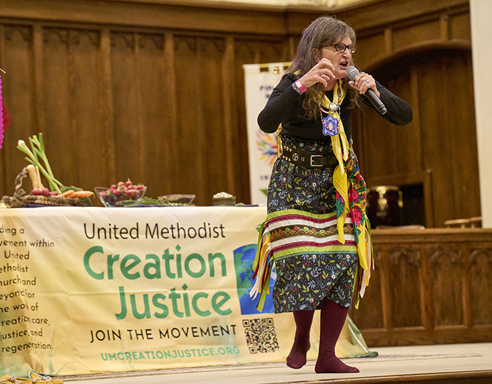 Ragghi Rain Calentine, an Eastern Cherokee storyteller and chair of the United Methodist Native American International Conference, participates in a service at First United Methodist Church of Charlotte on the eve of the 2024 United Methodist General Conference in Charlotte, N.C. Photo by Paul Jeffrey, UM News.